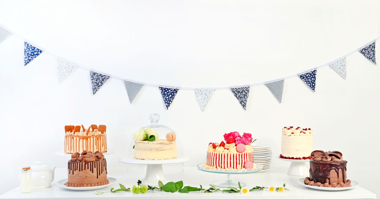 A lovely selection of celebration cakes on a tale